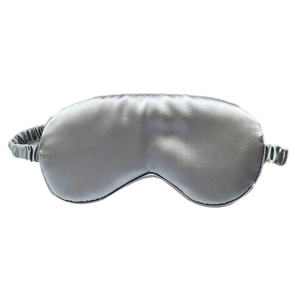 Silk double-sided eye mask in peacock blue and silver with adjustable strap, showing contoured nasal bridge design
