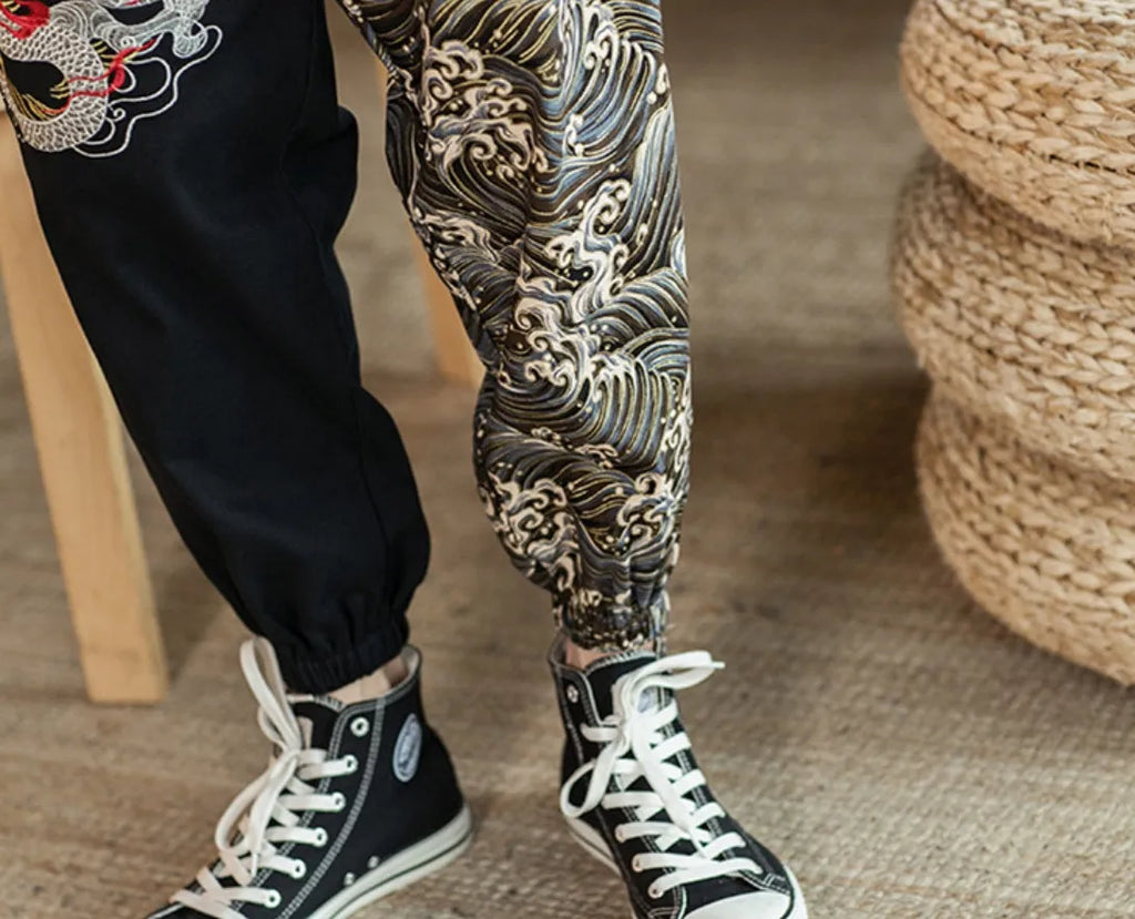 Embroidered silver dragon pattern on beige cotton casual trousers with mid-waist design