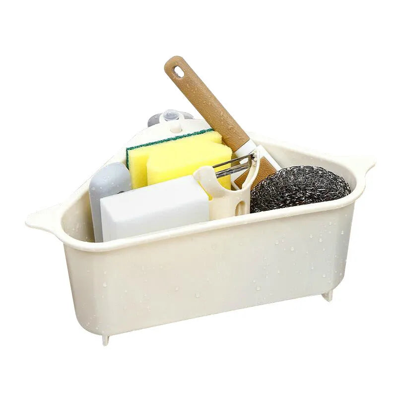 Beige plastic triangle sink storage rack for draining sponges, shown mounted on a kitchen faucet.