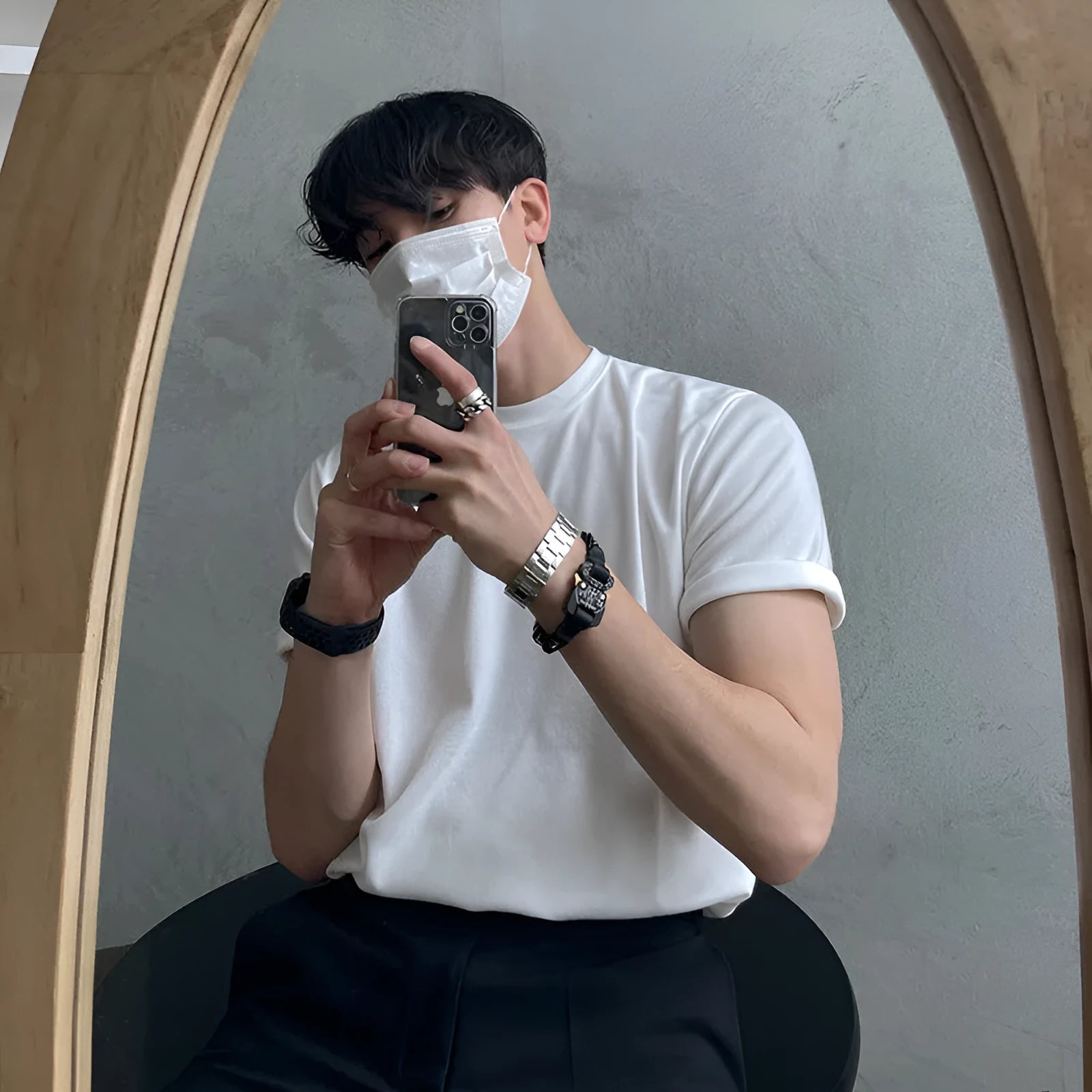 Men's slim fit cotton t-shirt in white or black with round neck and half sleeves on a model
