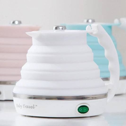 Foldable electric kettle in white, blue, and pink with UK, US, and EU plugs