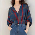 Women's loose-fit pullover top with painted pattern, short length, and drop-shoulder sleeves in polyester