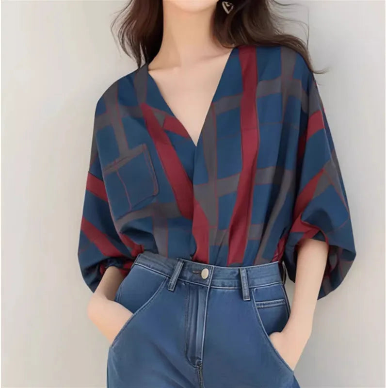 Women's loose-fit pullover top with painted pattern, short length, and drop-shoulder sleeves in polyester