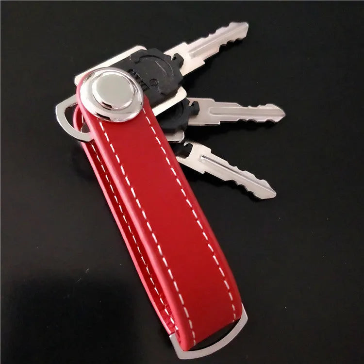 Creative folding key holder in metal copper chrome and cowhide, showing two keyposts and non-slip silicone pad, 85mm length