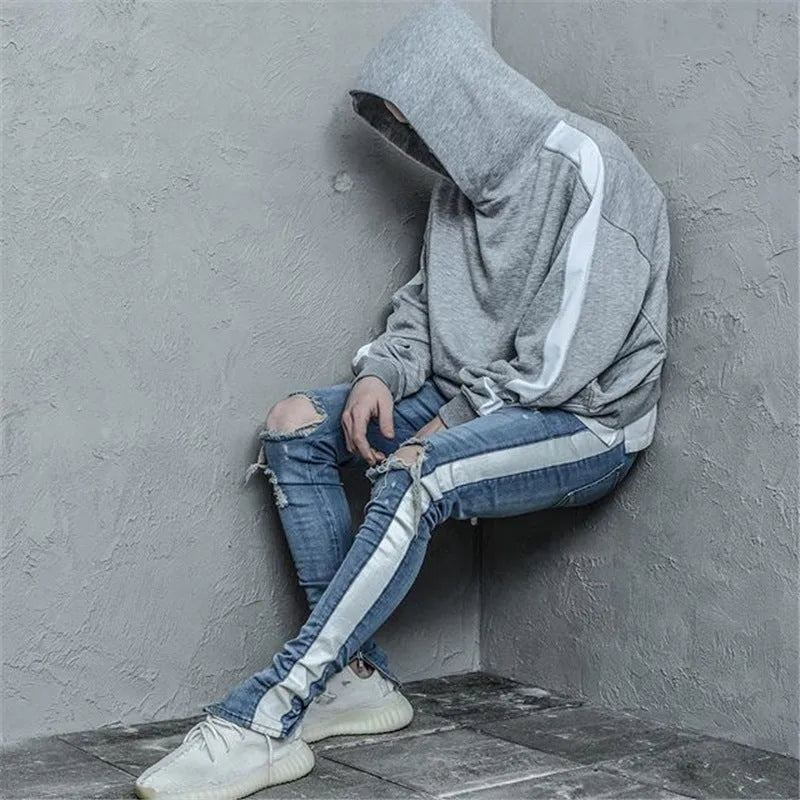 Men's ripped cotton denim slim fit jeans with distressed details in black and blue options