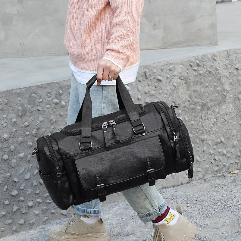 Black waterproof PU travel bag with a separate shoe compartment, shown with dimensions 52cm x 19cm x 27cm.