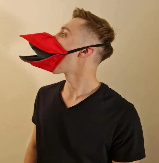 Handcrafted duck design face cover in absorbent cotton, available in black, red, and yellow