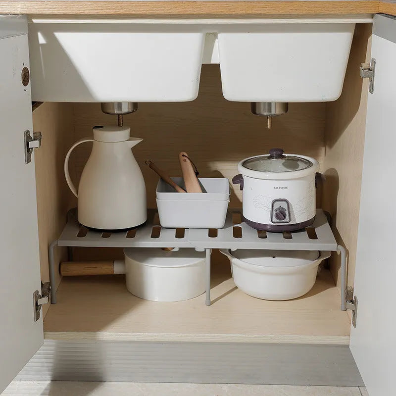 White telescopic plastic kitchen rack at extended height with ground installation