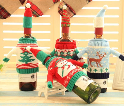 Knitted Christmas Bottle Set with festive designs including Joy, Christmas tree, elk, and snowman
