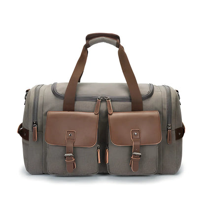 Medium canvas travel bag in black, 53x31x24cm with zipper top, double padded straps, waterproof canvas for 20-35L storage