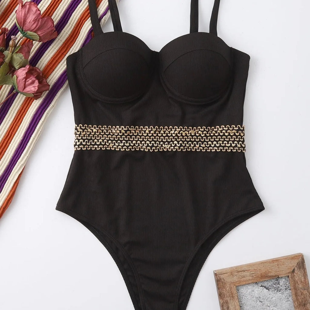 Black one-piece swimsuit for women with a matching hard storage bag featuring an adjustable shoulder strap.