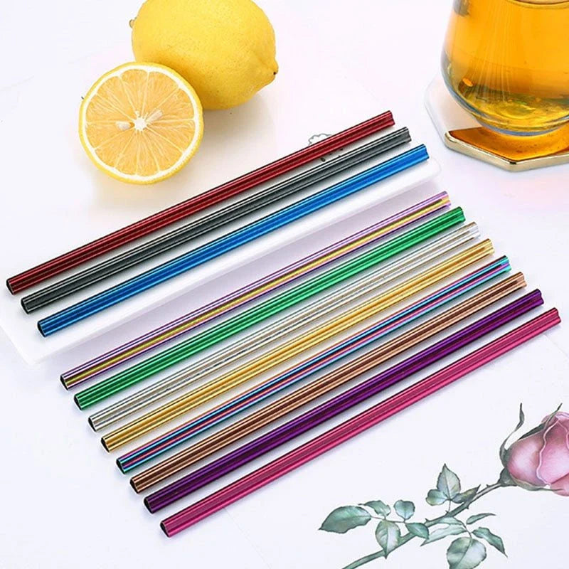 Reusable heart-shaped stainless steel straws in various colours with cleaning brush