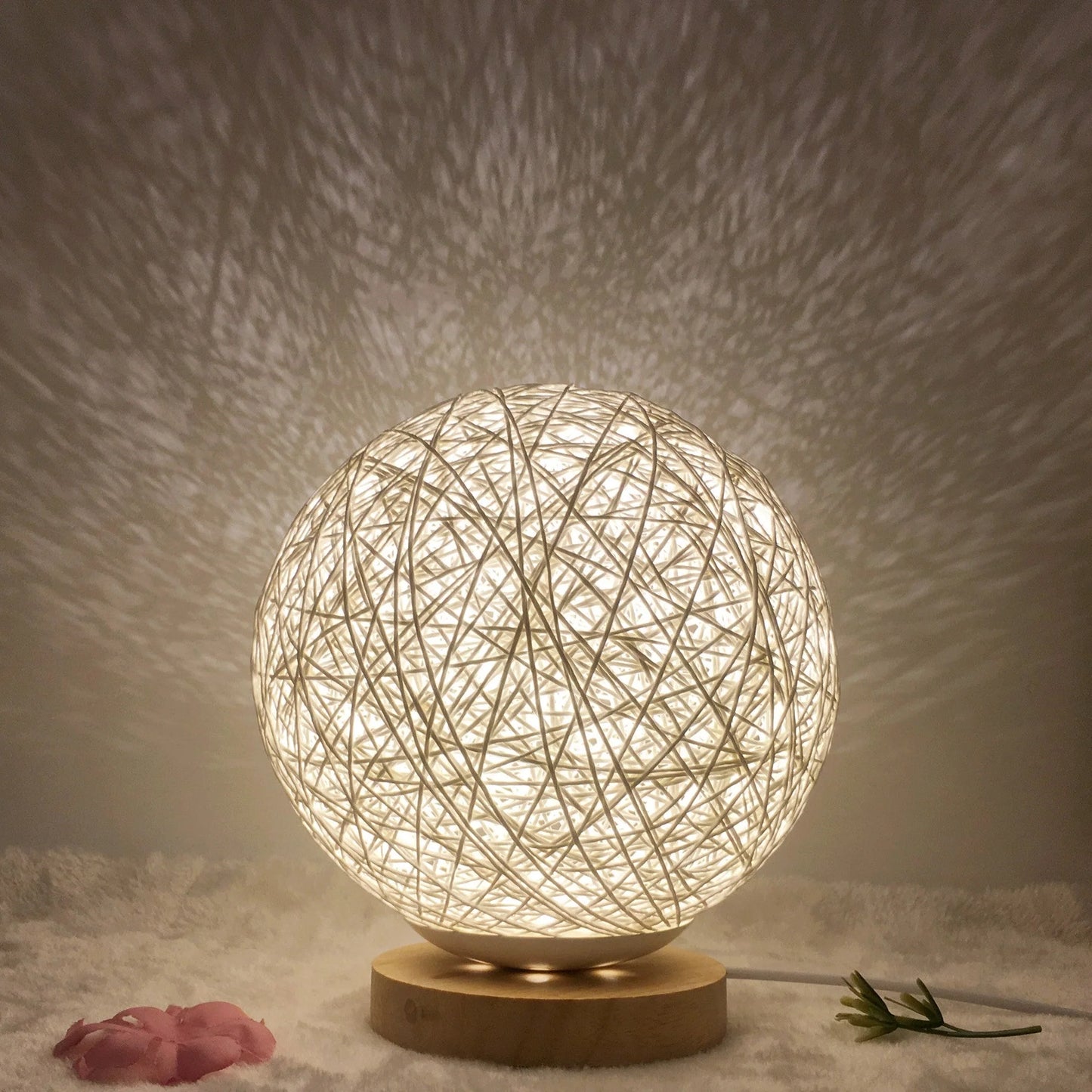 LED rattan table lamp with hand-knit lampshade in various colours