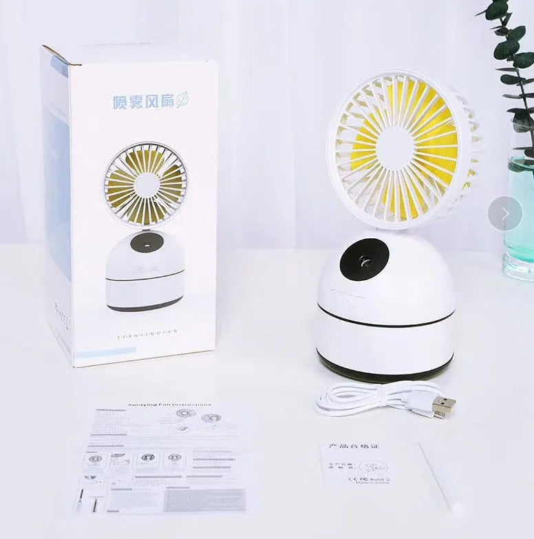 Portable USB fan humidifier in white with cool mist output and integrated fan, placed on a desk