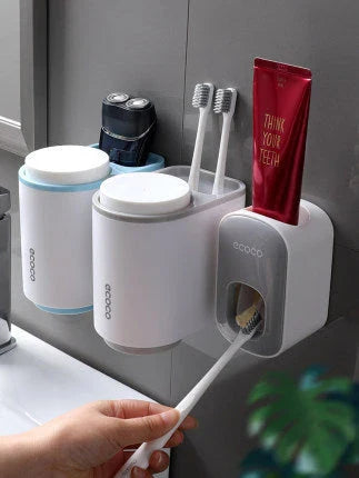 Wall-mounted automatic toothpaste dispenser with upside-down mouthwash cup for convenient and hygienic bathroom organization