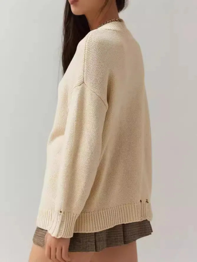 Milky white women's jacquard knit pullover sweater with round neck and long sleeves