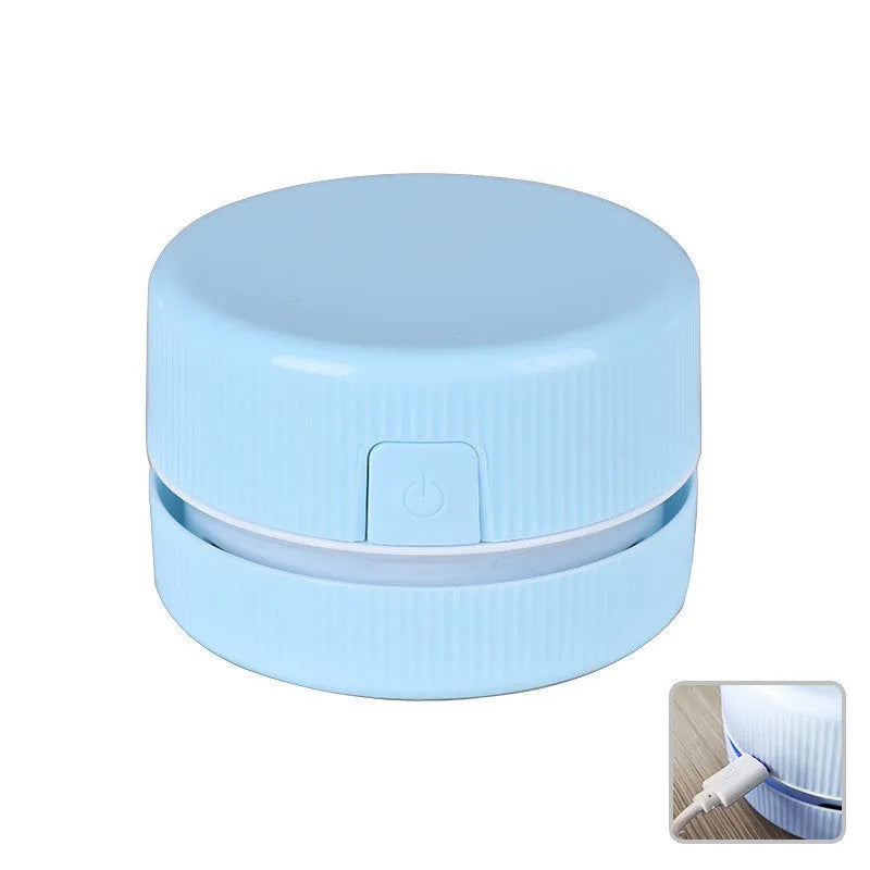 Blue portable mini handheld desktop vacuum cleaner with dust box for eraser chips.