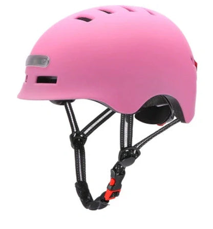 Black cycling helmet with built-in LED headlight and taillight showing adjustable dial and ventilation ports