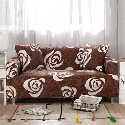 Printed stretchable sofa slipcover covering a three-seater sofa in a modern geometric pattern