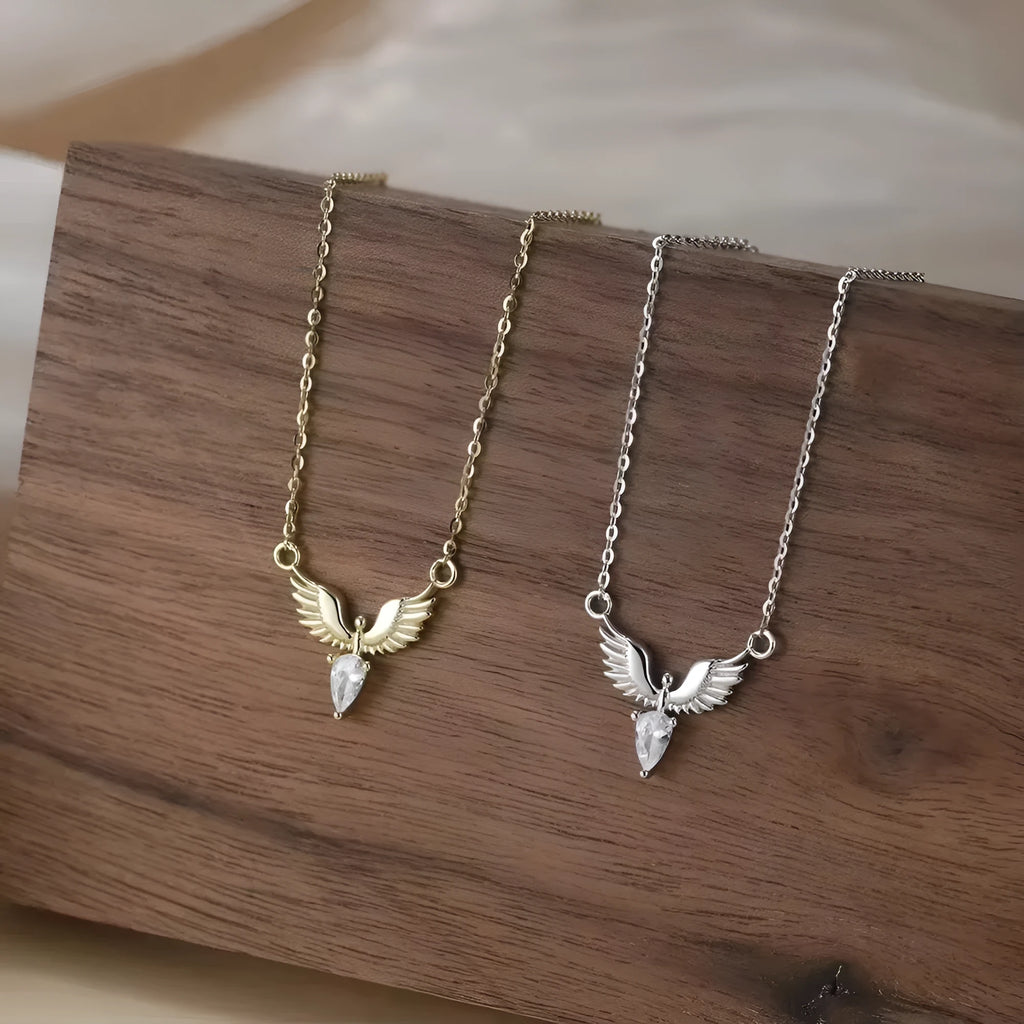 Eagle pendant necklace on an adjustable O-ring chain, available in white gold or yellow gold electroplate.