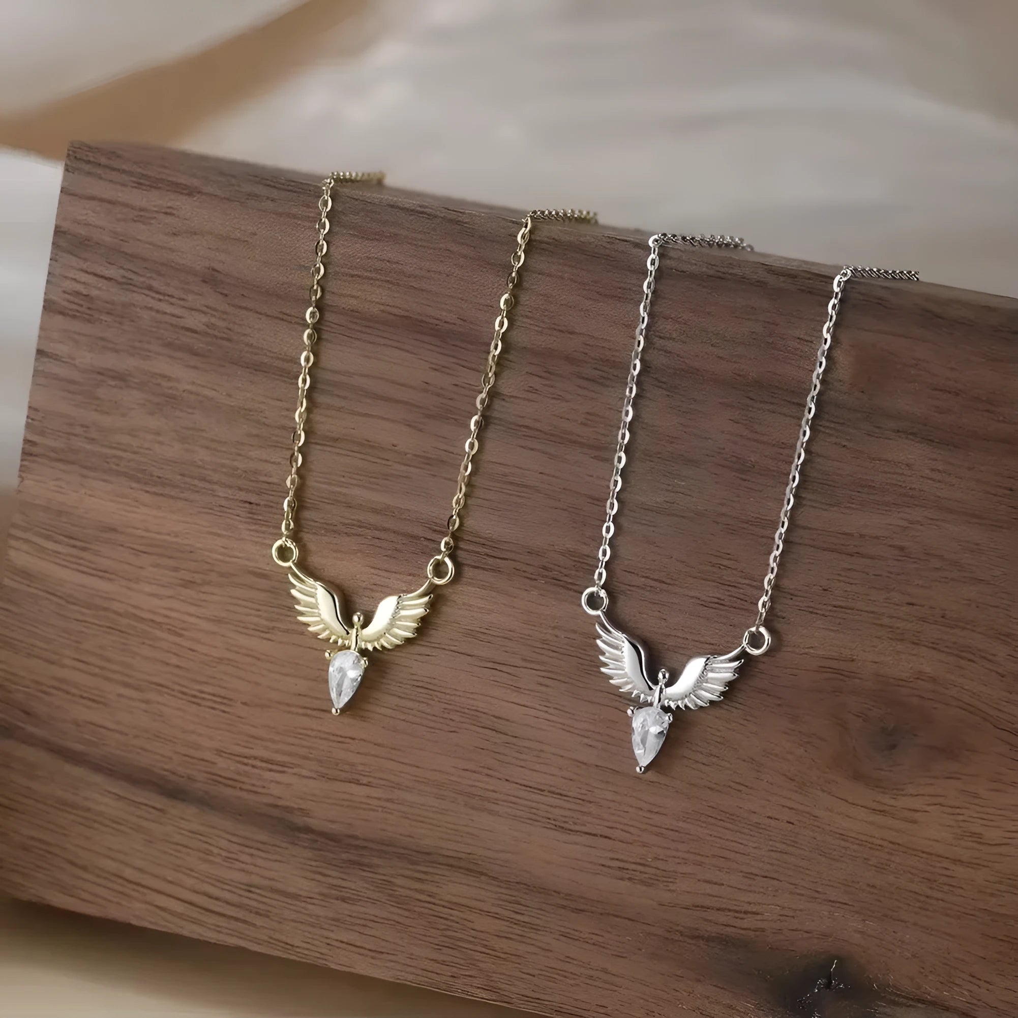 Eagle pendant necklace on an adjustable O-ring chain, available in white gold or yellow gold electroplate.