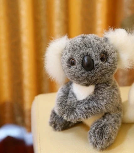 Soft plush koala doll with 100% PP cotton filling, available in 12cm, 16cm, 20cm, and 28cm sizes