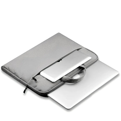 Grey laptop sleeve for MacBook with ant cloth exterior and soft handle, showing internal plush lining