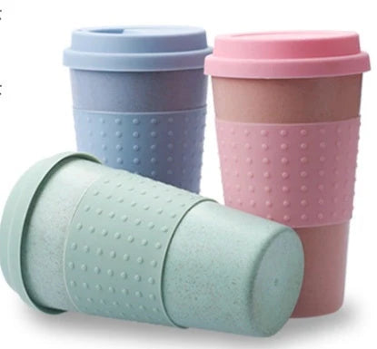 Eco-friendly wheat straw coffee cup with silicone lid in green, pink, and blue