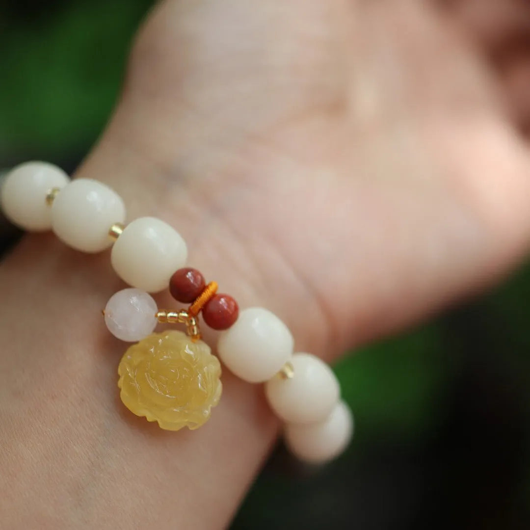 Natural bodhi root bracelet with 10mm beads in gradient white jade colour and lotus pendant