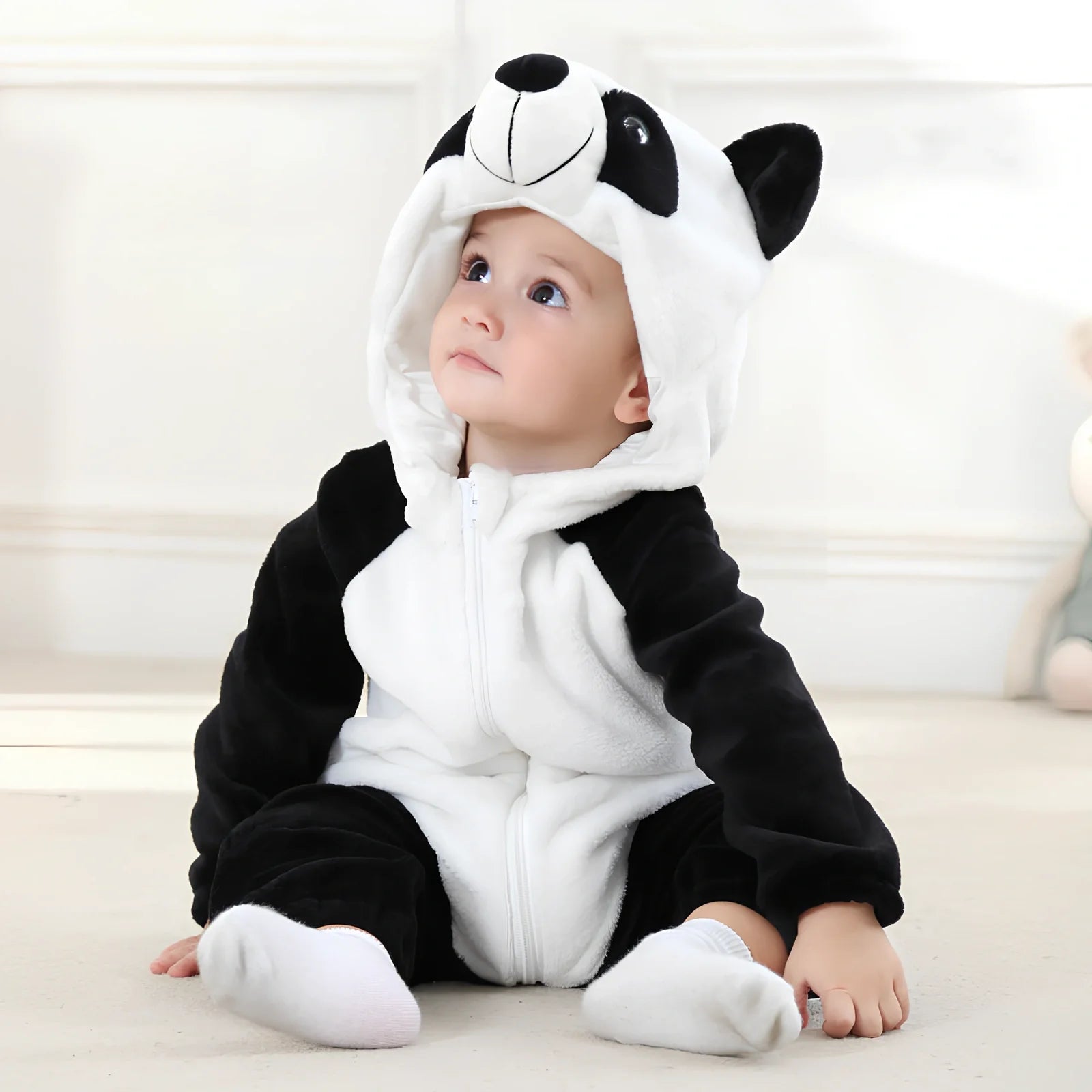 Cotton flannel baby romper with animal print design for winter wear, showing reinforced stitching and soft fabric texture