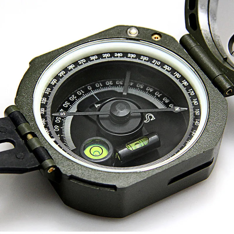 M2 outdoor professional geological compass in green with dimensions 140x83x116mm on a rocky surface