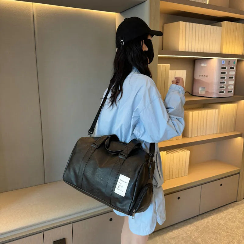 Large and small size dry wet separation PU fitness shoulder messenger bag on a white background.