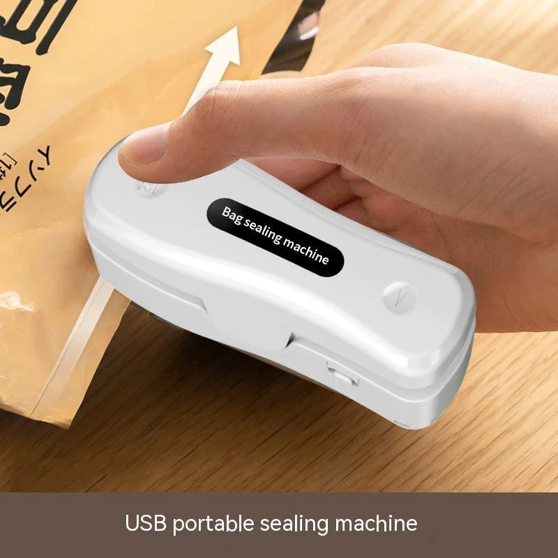 Compact USB mini sealing machine in black and milky white for kitchen use