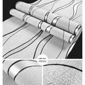 Close-up of light grey 3D Curve Stripe pattern on thick velvet wallpaper texture.