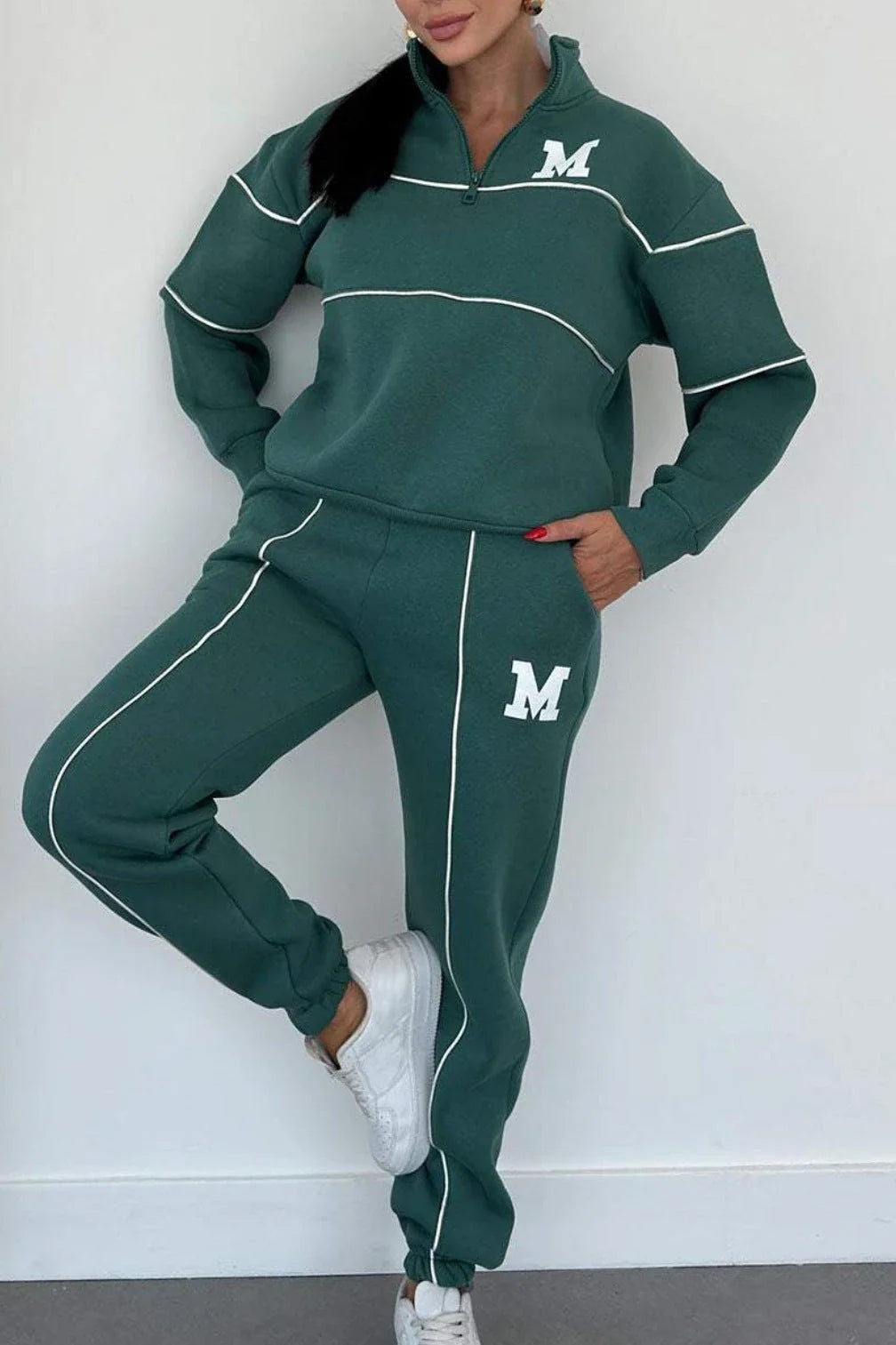 Comfortable and stylish two-piece loungewear set for women, featuring a hoodless pullover sweatshirt and relaxed-fit sweatpants with pockets.