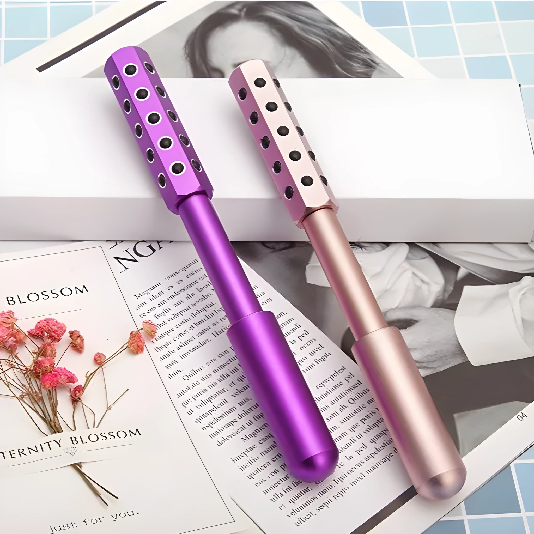 Purple handheld facial massage roller with 24 germanium beads, 193mm long