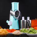 Spiralizer 3-blade vegetable slicer with transparent barrel and red plastic body on white background