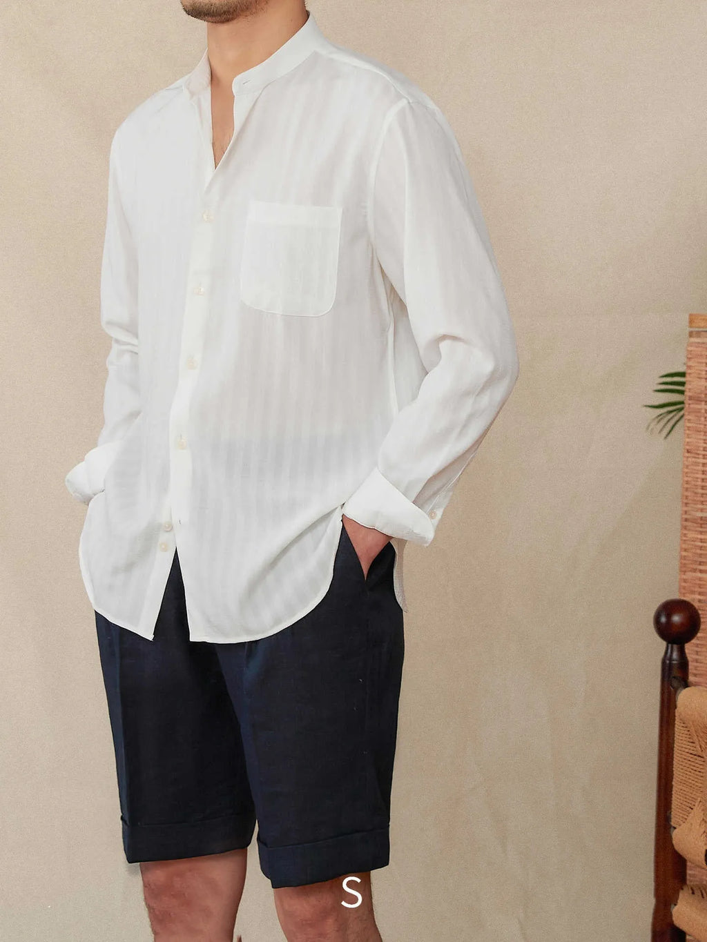 Blue and white seersucker striped long sleeve shirt with a loose lapel and baseball collar.