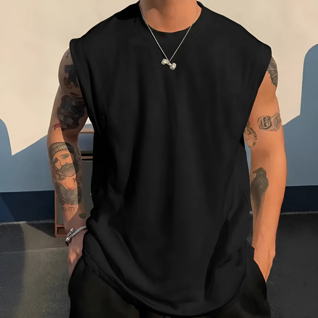 Men's loose solid colour cotton tank top t-shirt on a hanger, showing straight hem and sleeveless design.