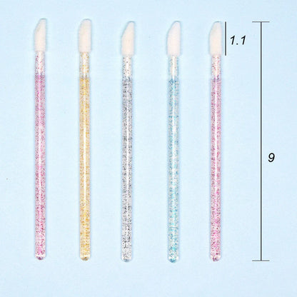 Crystal rod lip brush with synthetic fibre bristles in six colour options on white background