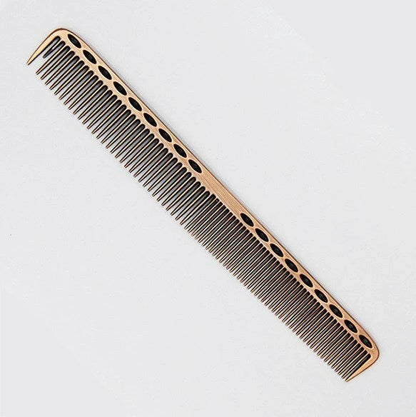 Space aluminium haircut comb in rose gold finish showing precise tooth spacing and polished metal surface