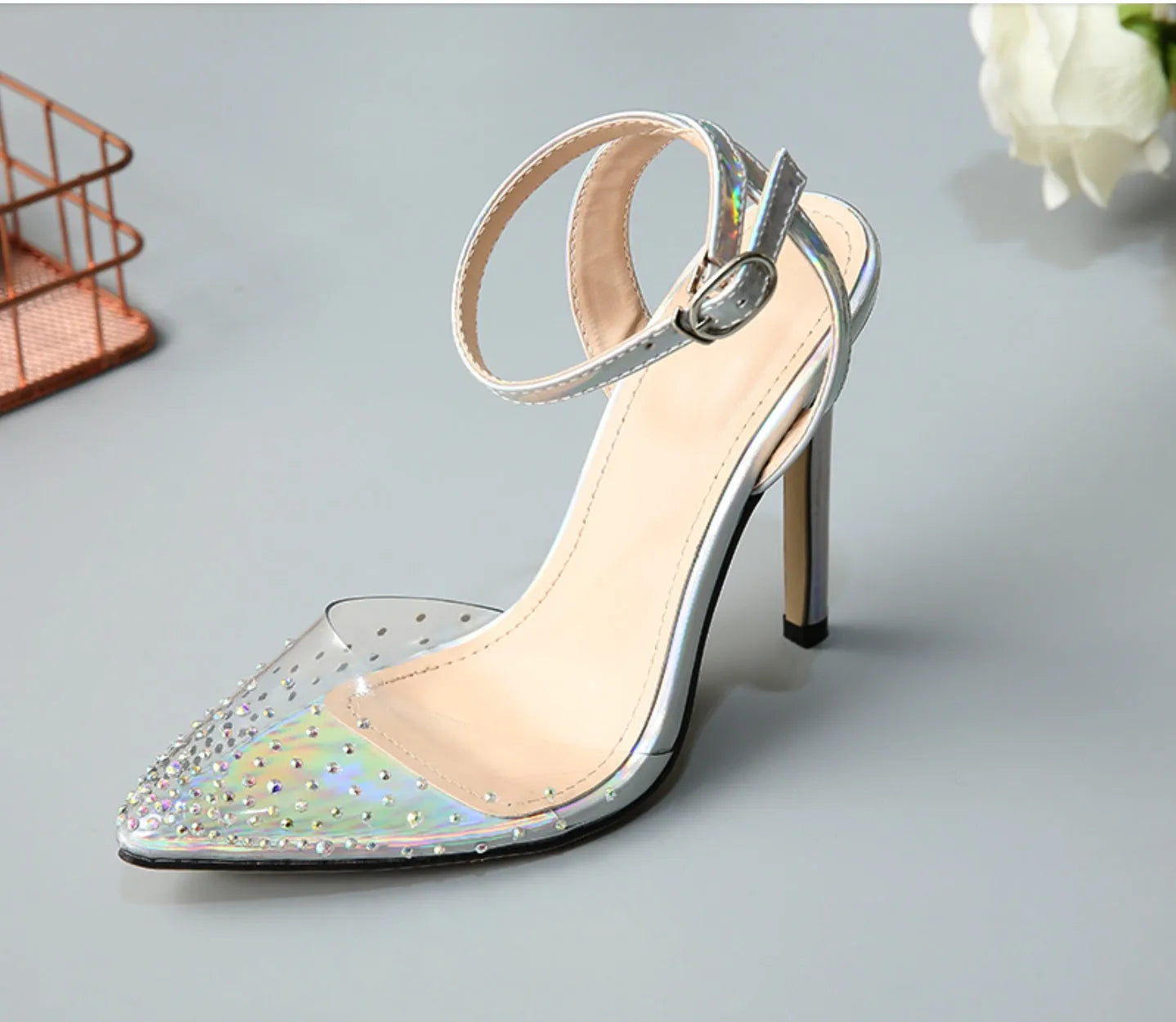 Women's pointed toe diamond embellished sandals with a stiletto heel on a white background.
