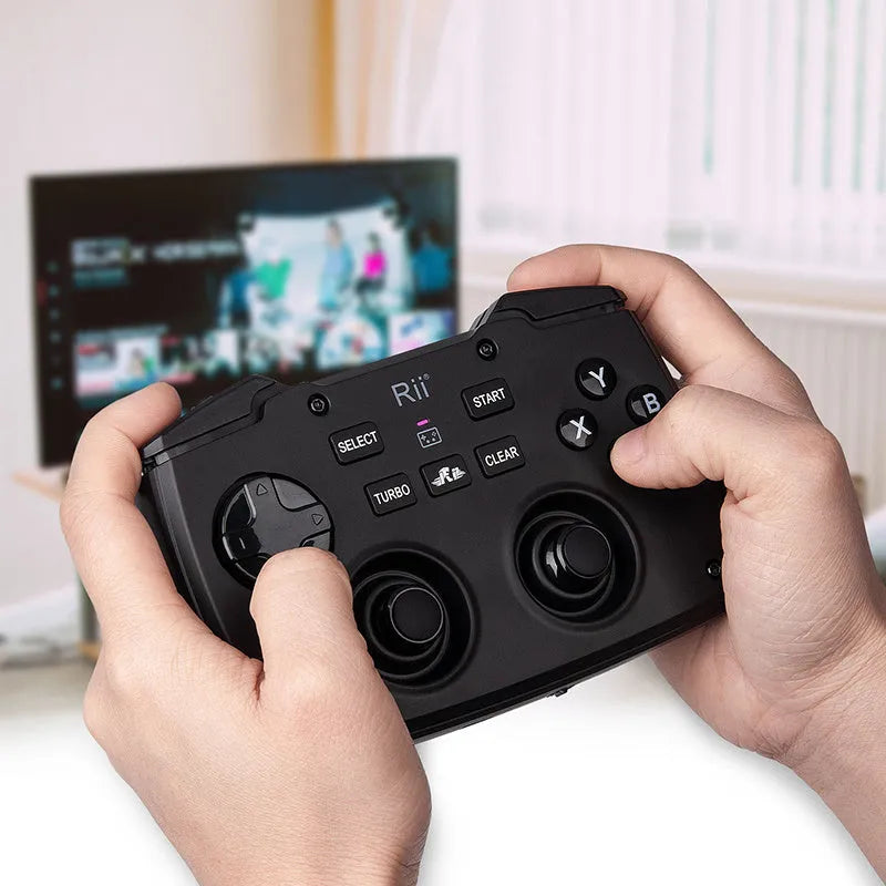Black wireless mini keyboard with USB receiver on desk