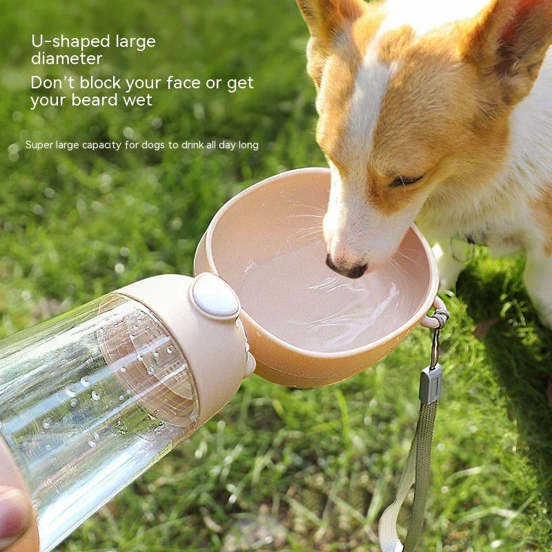 Portable pet water bottle with built-in food and water bowls for outdoor travel and adventures