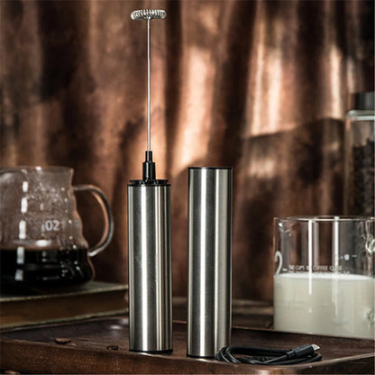 Handheld electric milk frother and blender in silver, with detachable whisk head