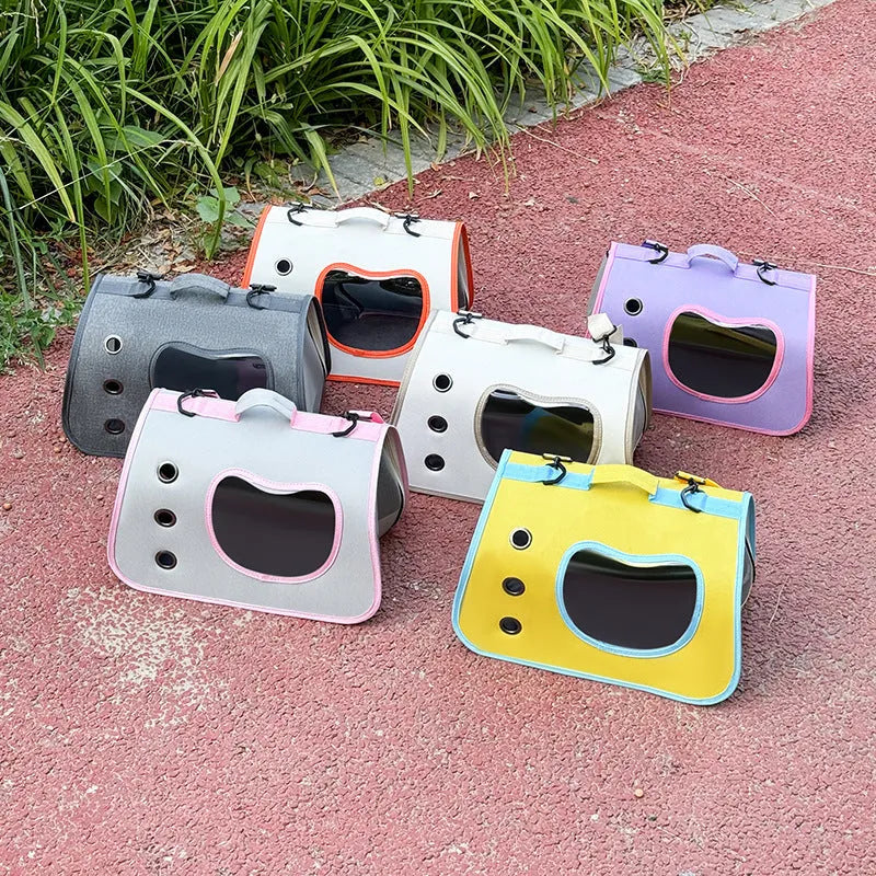 Crossbody pet carrier bag in Oxford cloth shown in multiple colour options including black, orange, and purple