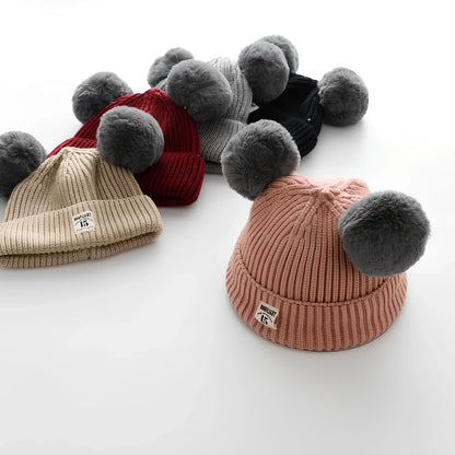 Crocheted baby wool cap in beige with soft 5 cm plush ball, high top style for 6 months-3 years winter warmth, flanged edge for secure fit