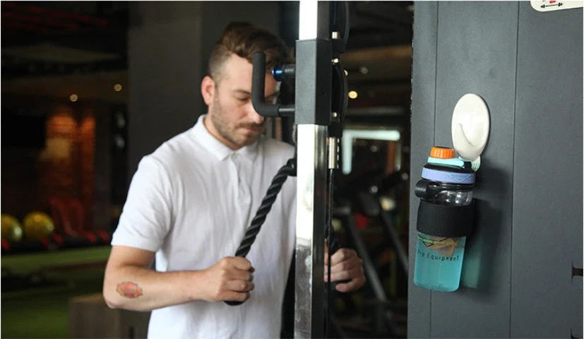 Adjustable magnetic water cup belt in black, blue, and green for fitness and outdoor use