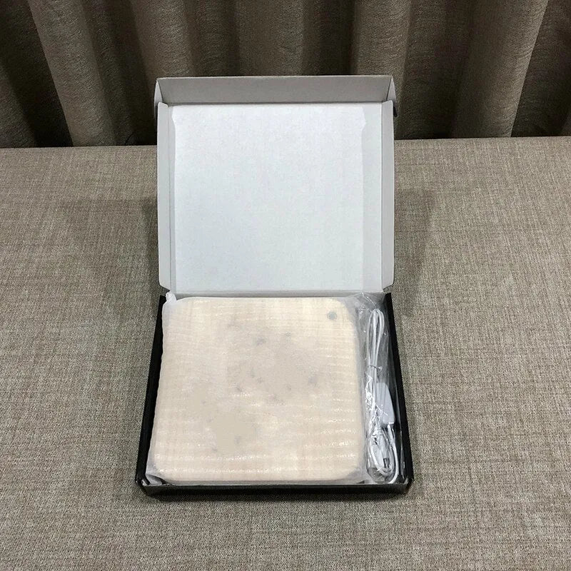 Square pine wood USB LED lamp emitting warm white light on a desk.