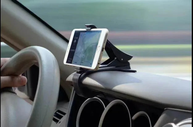 Black G-40 car bracket attached to steering wheel holding a mobile phone for navigation